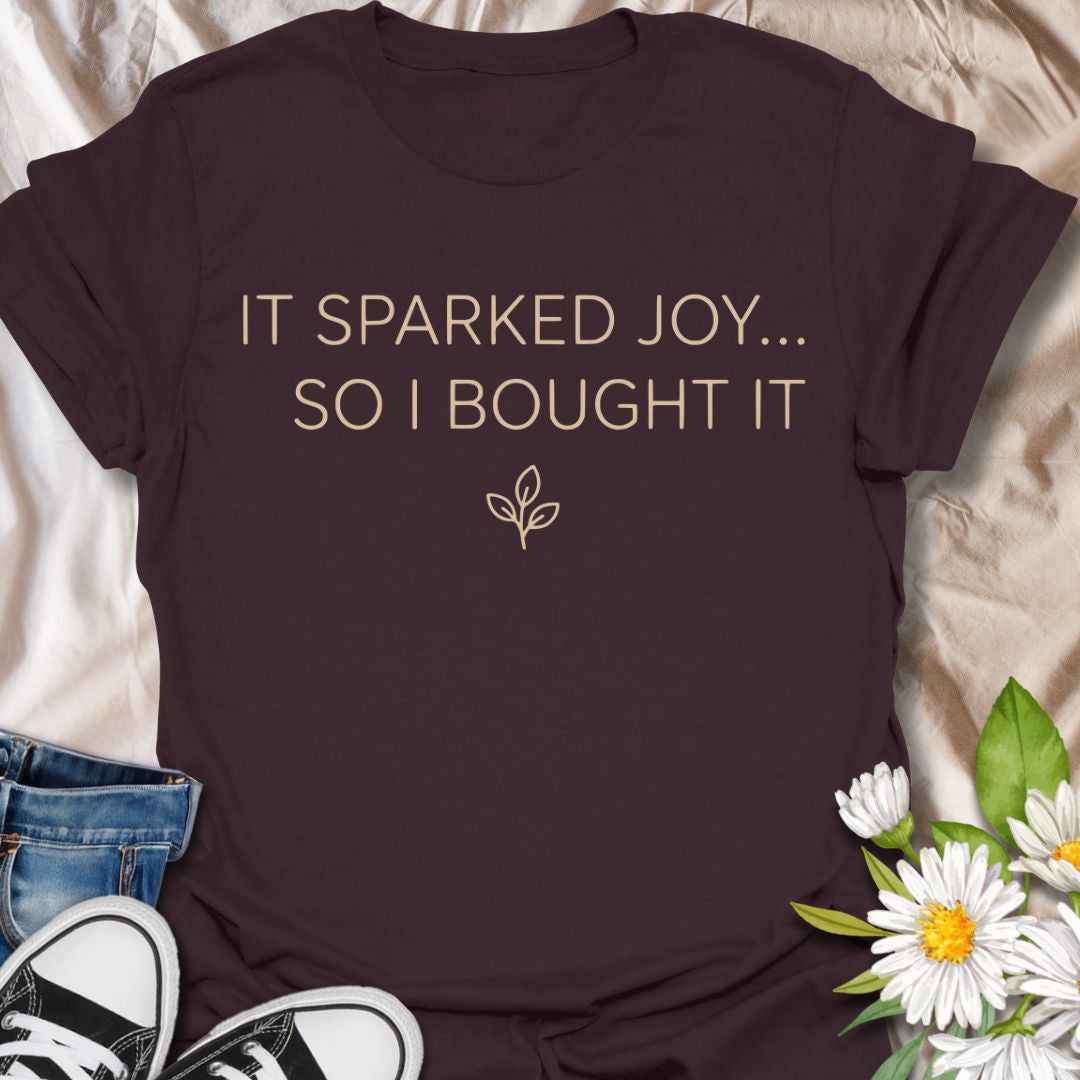 Funny plant lover t-shirt featuring “It Sparked Joy… So I Bought It.” Perfect for plant parents, houseplant collectors, and anyone who can’t resist one more plant. A clean, minimalist botanical tee for everyday wear or gifting.