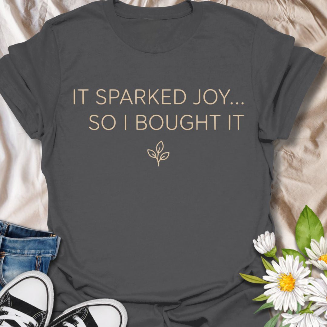 Funny plant lover t-shirt featuring “It Sparked Joy… So I Bought It.” Perfect for plant parents, houseplant collectors, and anyone who can’t resist one more plant. A clean, minimalist botanical tee for everyday wear or gifting.