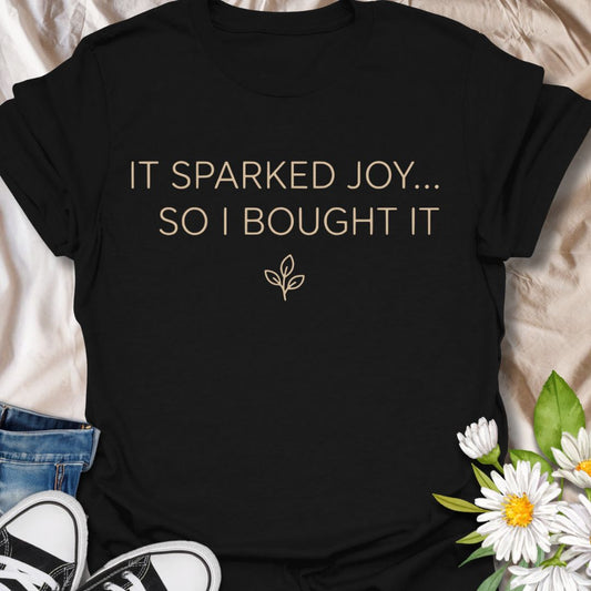Funny plant lover t-shirt featuring “It Sparked Joy… So I Bought It.” Perfect for plant parents, houseplant collectors, and anyone who can’t resist one more plant. A clean, minimalist botanical tee for everyday wear or gifting.