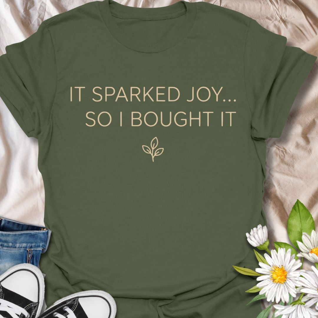 Funny plant lover t-shirt featuring “It Sparked Joy… So I Bought It.” Perfect for plant parents, houseplant collectors, and anyone who can’t resist one more plant. A clean, minimalist botanical tee for everyday wear or gifting.
