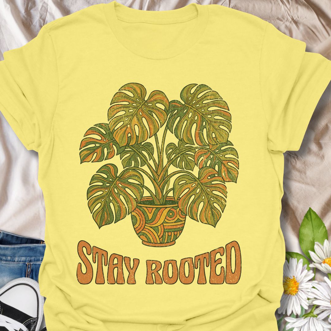 Stylish plant lover t-shirt featuring a vibrant monstera design with “Stay Rooted.” Perfect for plant parents, nature lovers, and botanical aesthetics. A positive, nature-inspired tee ideal for everyday wear or thoughtful gifting.
