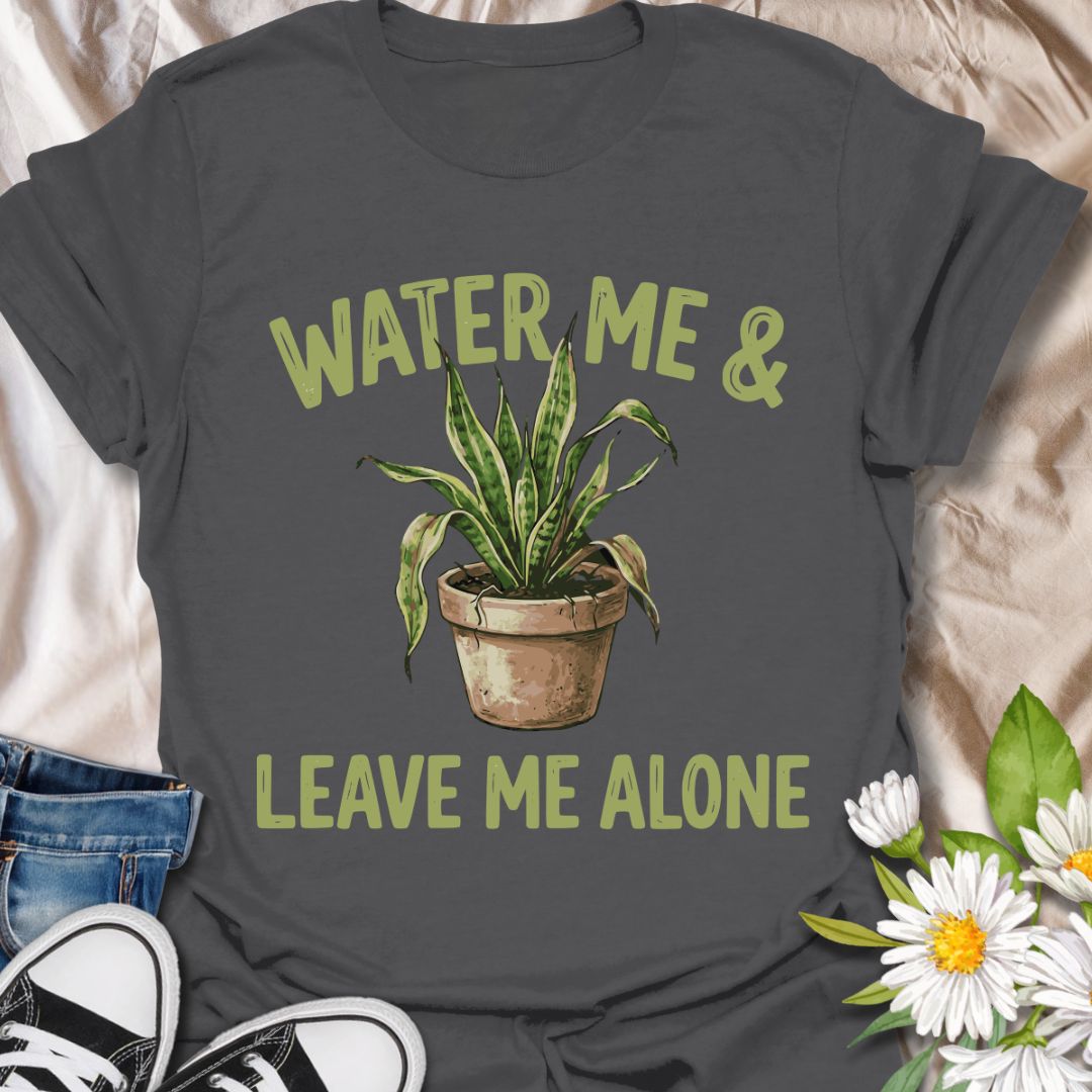 Funny plant lover t-shirt featuring “Water Me &amp; Leave Me Alone” with a houseplant graphic. Perfect for plant parents, introverts, and anyone who loves plants and personal space. A relatable botanical tee for everyday wear or gifting.