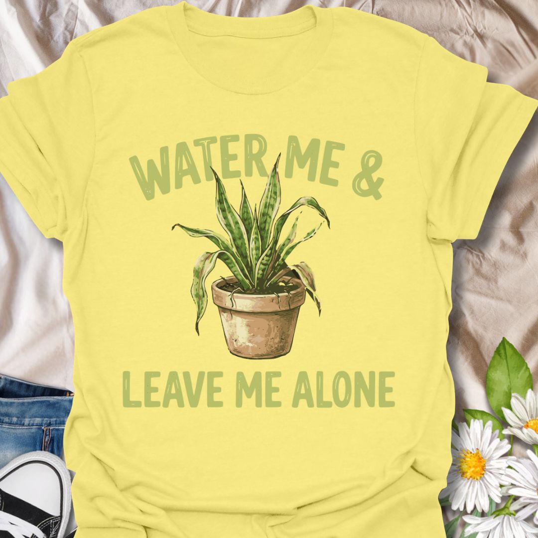 Funny plant lover t-shirt featuring “Water Me &amp; Leave Me Alone” with a houseplant graphic. Perfect for plant parents, introverts, and anyone who loves plants and personal space. A relatable botanical tee for everyday wear or gifting.