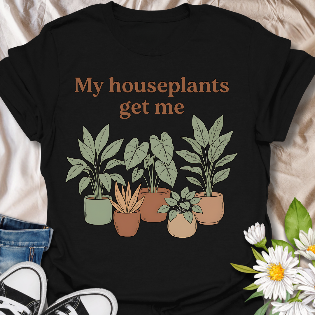 Funny houseplant lover t-shirt featuring leafy potted plants and the phrase “My houseplants get me”. A cozy botanical graphic tee for plant parents, indoor plant fans, and anyone obsessed with houseplants.
