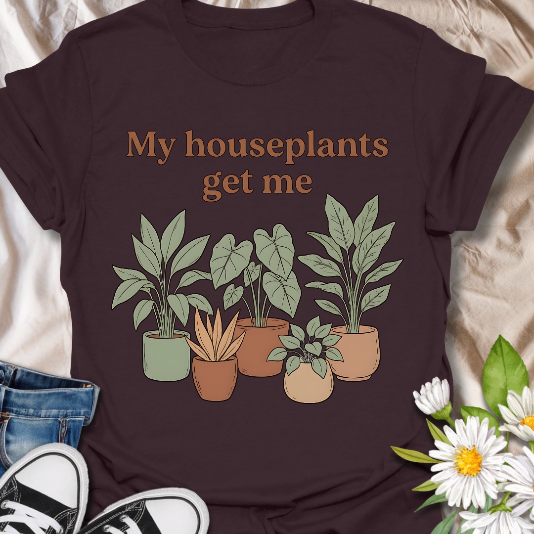 Funny houseplant lover t-shirt featuring leafy potted plants and the phrase “My houseplants get me”. A cozy botanical graphic tee for plant parents, indoor plant fans, and anyone obsessed with houseplants.