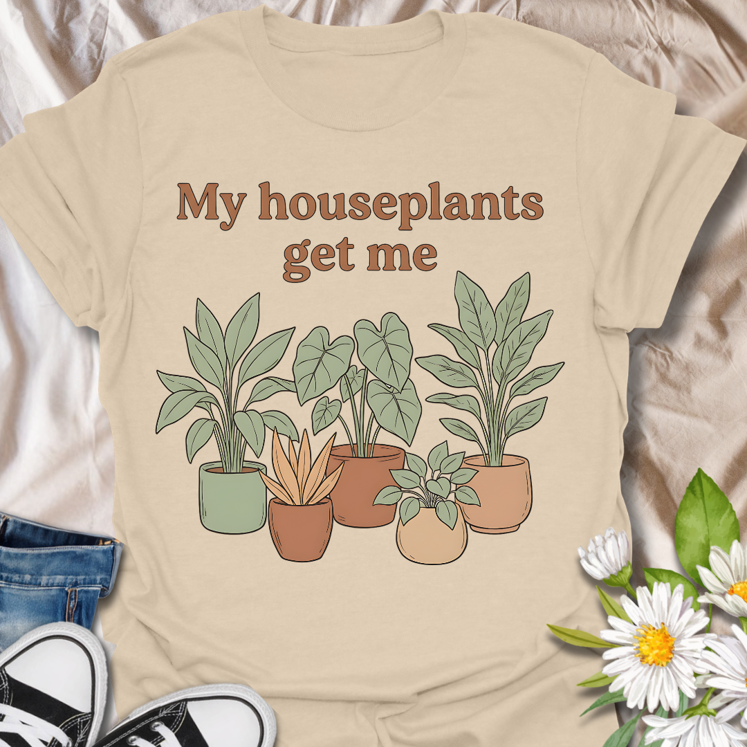 Funny houseplant lover t-shirt featuring leafy potted plants and the phrase “My houseplants get me”. A cozy botanical graphic tee for plant parents, indoor plant fans, and anyone obsessed with houseplants.