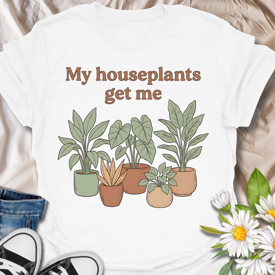 Funny houseplant lover t-shirt featuring leafy potted plants and the phrase “My houseplants get me”. A cozy botanical graphic tee for plant parents, indoor plant fans, and anyone obsessed with houseplants.