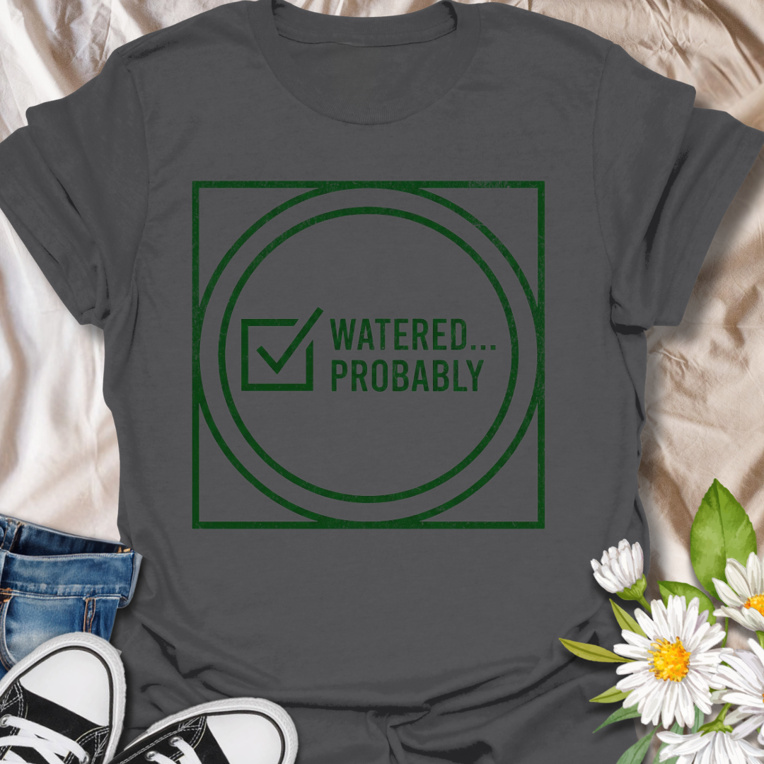 Funny plant lover t-shirt featuring the phrase “Watered… Probably” in a distressed green graphic. A relatable botanical tee for plant parents, houseplant owners, and indoor gardeners with a sense of humor.