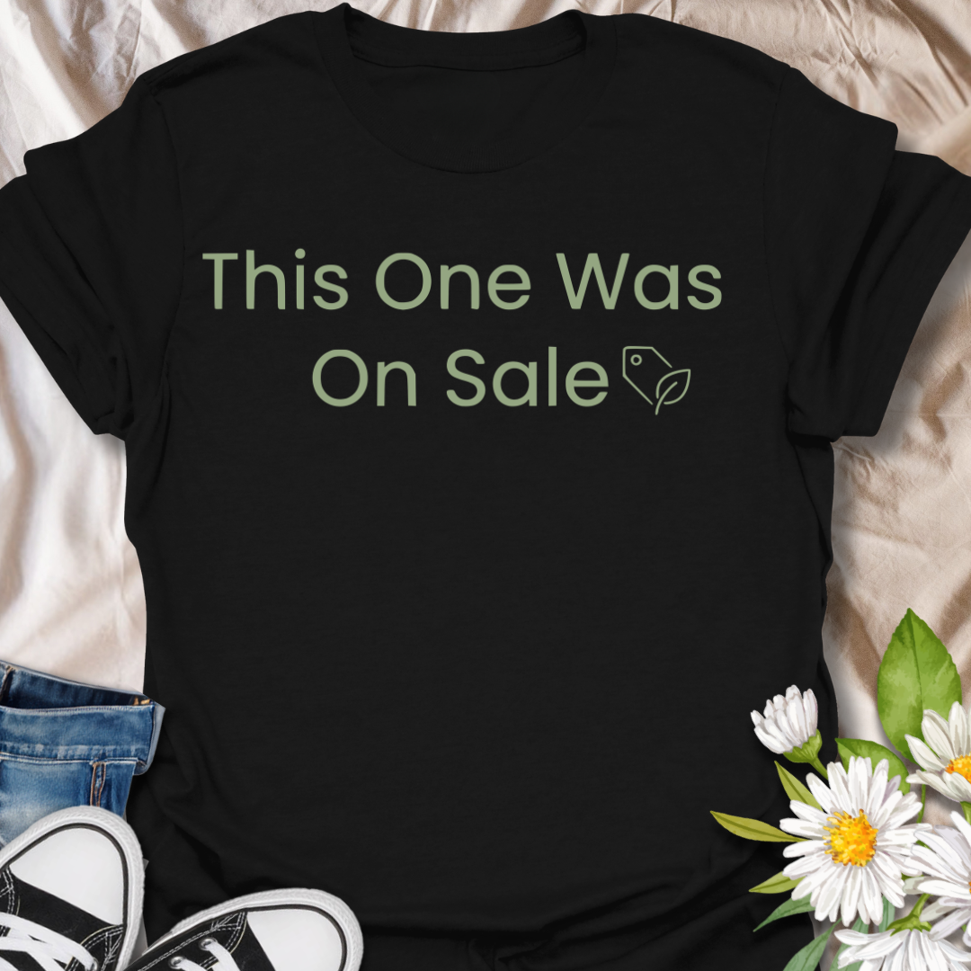 Funny plant lover t-shirt featuring the phrase “This One Was On Sale” with a simple botanical tag icon. A relatable houseplant tee for plant parents, indoor plant fans, and anyone who always makes room for one more plant.