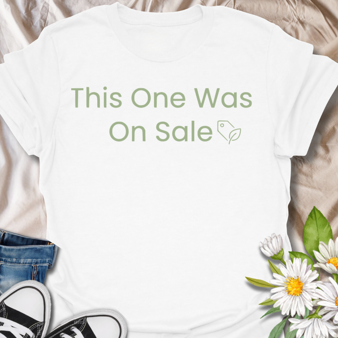 Funny plant lover t-shirt featuring the phrase “This One Was On Sale” with a simple botanical tag icon. A relatable houseplant tee for plant parents, indoor plant fans, and anyone who always makes room for one more plant.