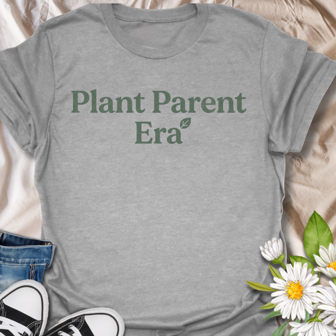 Cute plant parent t-shirt featuring the phrase “Plant Parent Era” in a simple botanical style. A trendy houseplant tee for plant lovers, indoor gardeners, and anyone fully in their plant parent era.