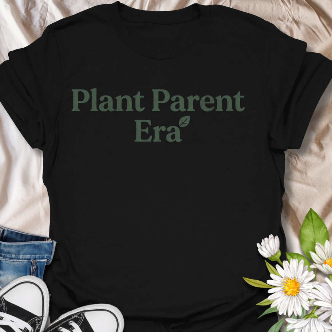 Cute plant parent t-shirt featuring the phrase “Plant Parent Era” in a simple botanical style. A trendy houseplant tee for plant lovers, indoor gardeners, and anyone fully in their plant parent era.