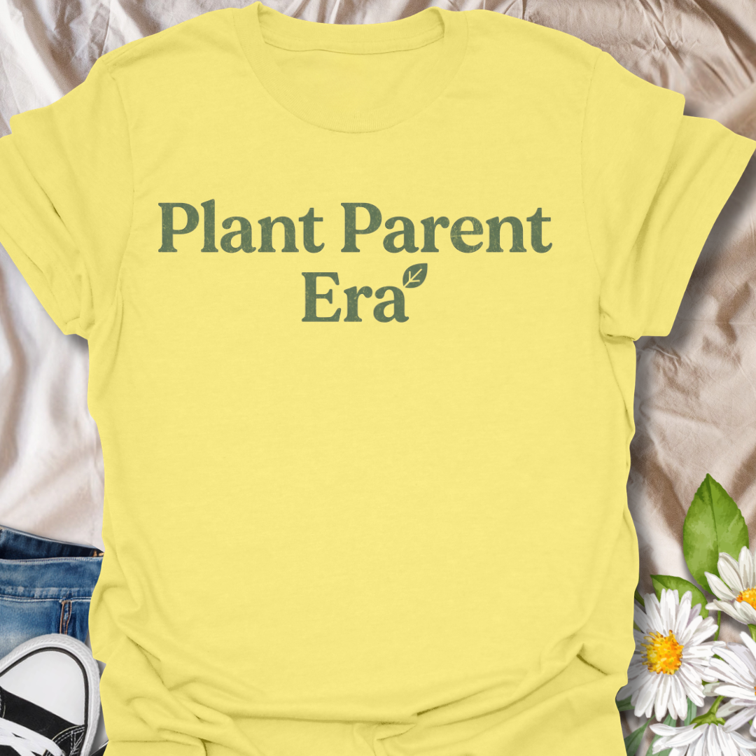 Cute plant parent t-shirt featuring the phrase “Plant Parent Era” in a simple botanical style. A trendy houseplant tee for plant lovers, indoor gardeners, and anyone fully in their plant parent era.