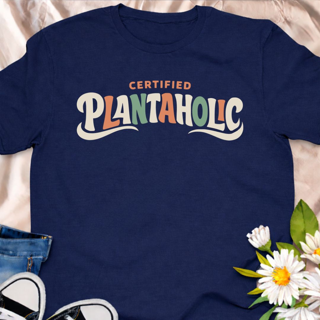 Funny plant lover t-shirt featuring the phrase “Certified Plantaholic” in a retro botanical style. A playful houseplant tee for plant parents, indoor gardeners, and anyone proudly obsessed with plants.