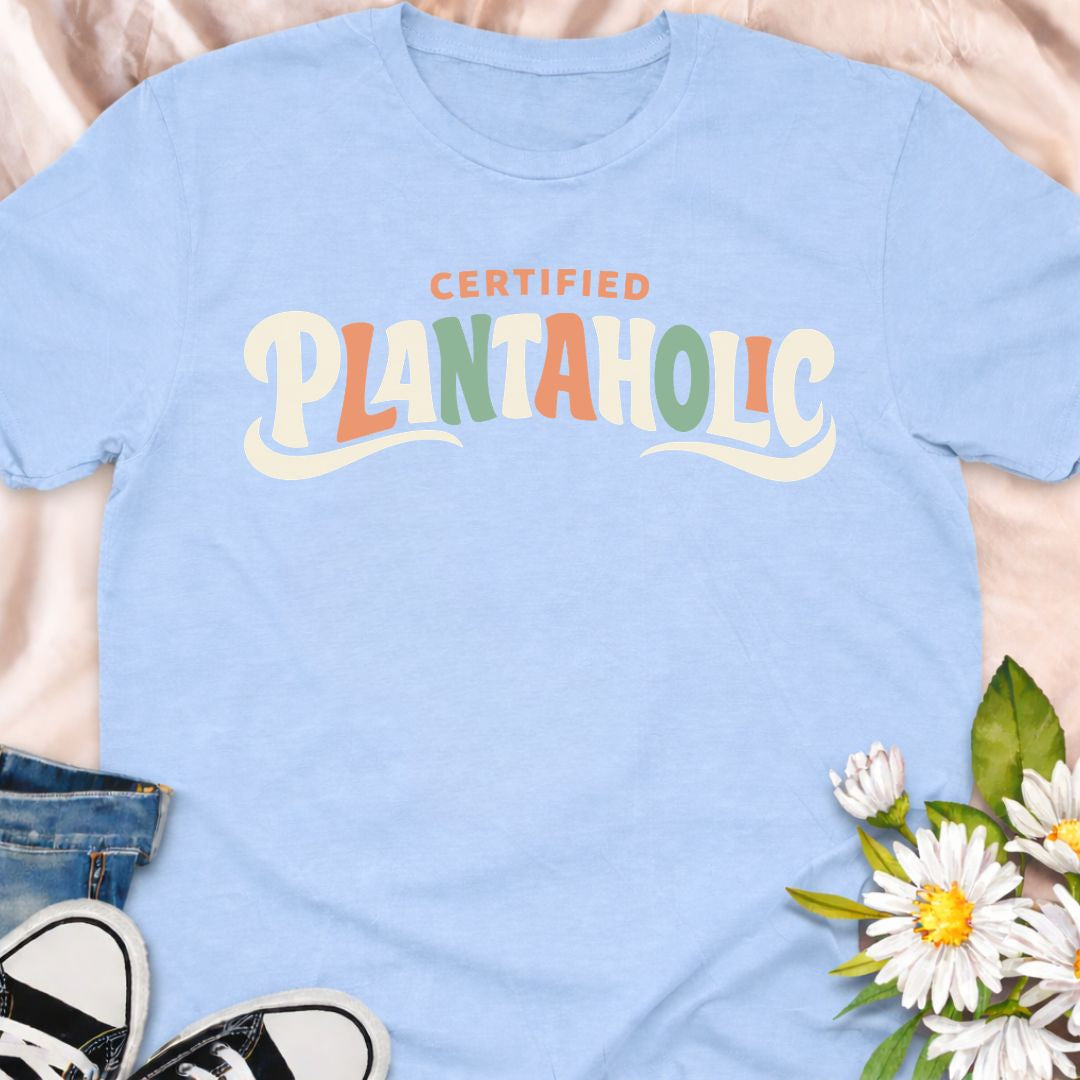 Funny plant lover t-shirt featuring the phrase “Certified Plantaholic” in a retro botanical style. A playful houseplant tee for plant parents, indoor gardeners, and anyone proudly obsessed with plants.