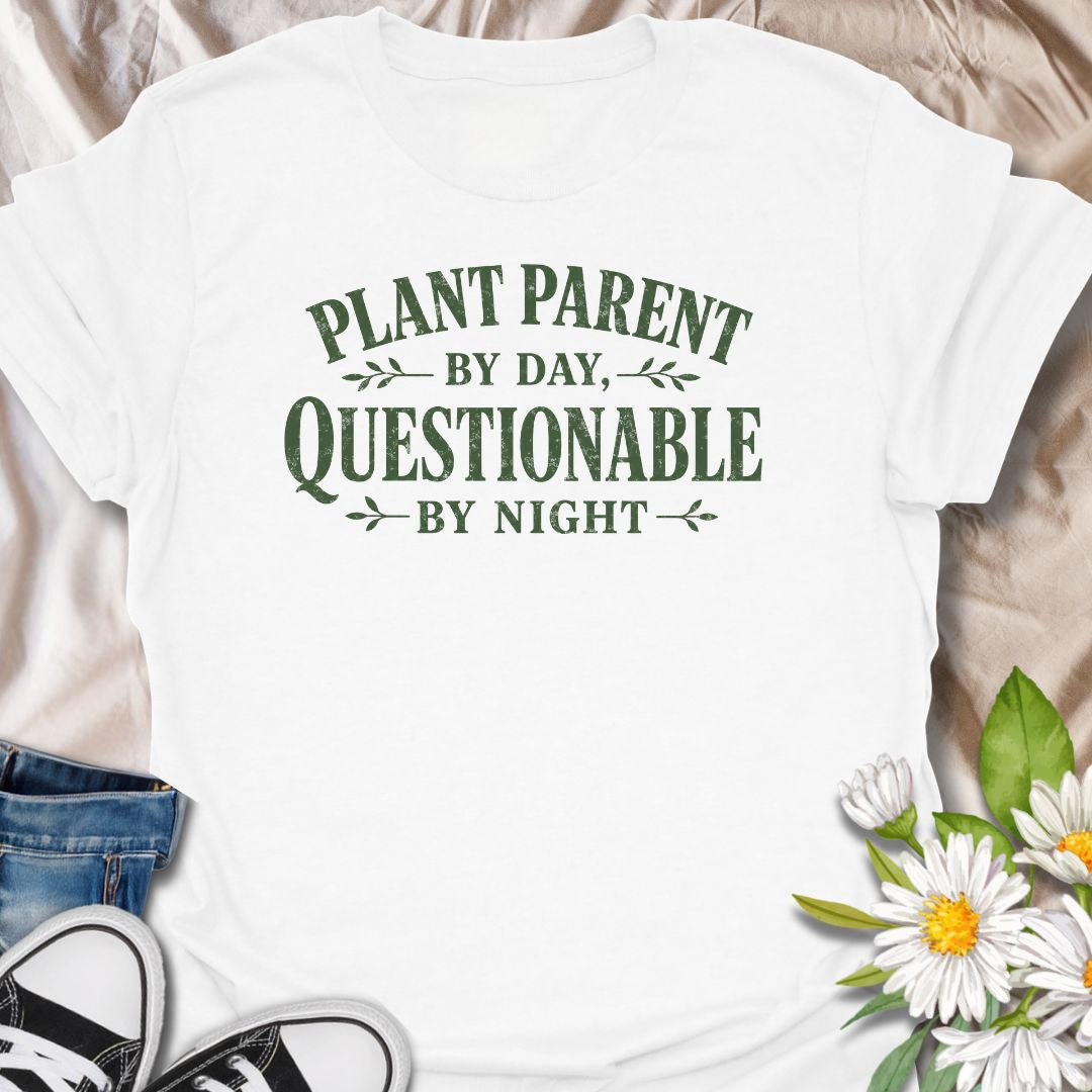 Funny plant lover t-shirt featuring the phrase “Plant Parent by Day, Questionable by Night.” A playful tee for plant parents, houseplant lovers, indoor gardeners, and anyone with a slightly mischievous sense of humor and a serious love of plants.