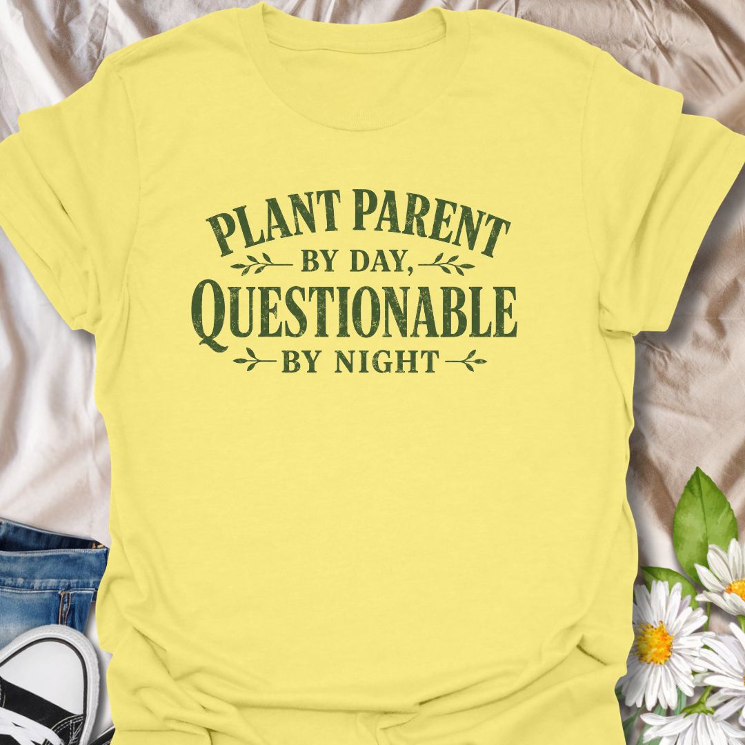 Funny plant lover t-shirt featuring the phrase “Plant Parent by Day, Questionable by Night.” A playful tee for plant parents, houseplant lovers, indoor gardeners, and anyone with a slightly mischievous sense of humor and a serious love of plants.