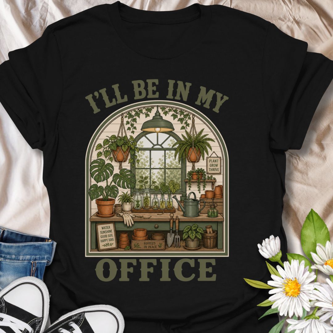 This I’ll Be In My Office t-shirt is made for plant lovers who would rather be surrounded by houseplants, propagation jars, watering cans, and greenhouse calm. The cozy illustrated design features a charming indoor plant room filled with hanging baskets, leafy plants, garden tools, and botanical details for a peaceful plant-parent feel. Perfect for plant moms, houseplant collectors, gardeners, greenhouse lovers, propagation fans, and anyone whose happy place is their own leafy little office.