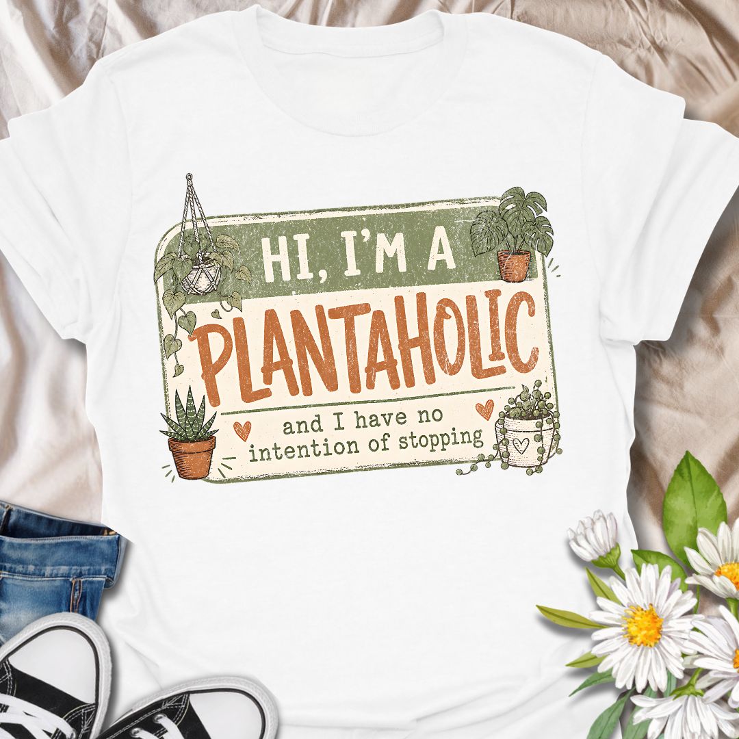 This Hi, I’m A Plantaholic t-shirt is perfect for plant lovers who can never resist one more houseplant. Featuring a playful badge-style layout with potted plants, trailing vines, and the phrase and I have no intention of stopping, this design brings a fun and relatable plant-parent vibe to any casual outfit. A great gift for plant moms, houseplant collectors, propagation fans, indoor gardeners, and anyone proudly obsessed with their growing plant collection.