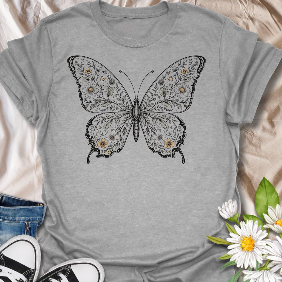 This Botanical Butterfly t-shirt is made for nature lovers who appreciate delicate details, soft floral beauty, and timeless butterfly artwork. Featuring an elegant butterfly illustration filled with intricate botanical linework and subtle floral accents, this design has a graceful vintage-inspired look that feels both artistic and wearable. Perfect for butterfly lovers, garden enthusiasts, pollinator fans, botanical art lovers, and anyone who wants a beautiful nature-themed graphic tee.