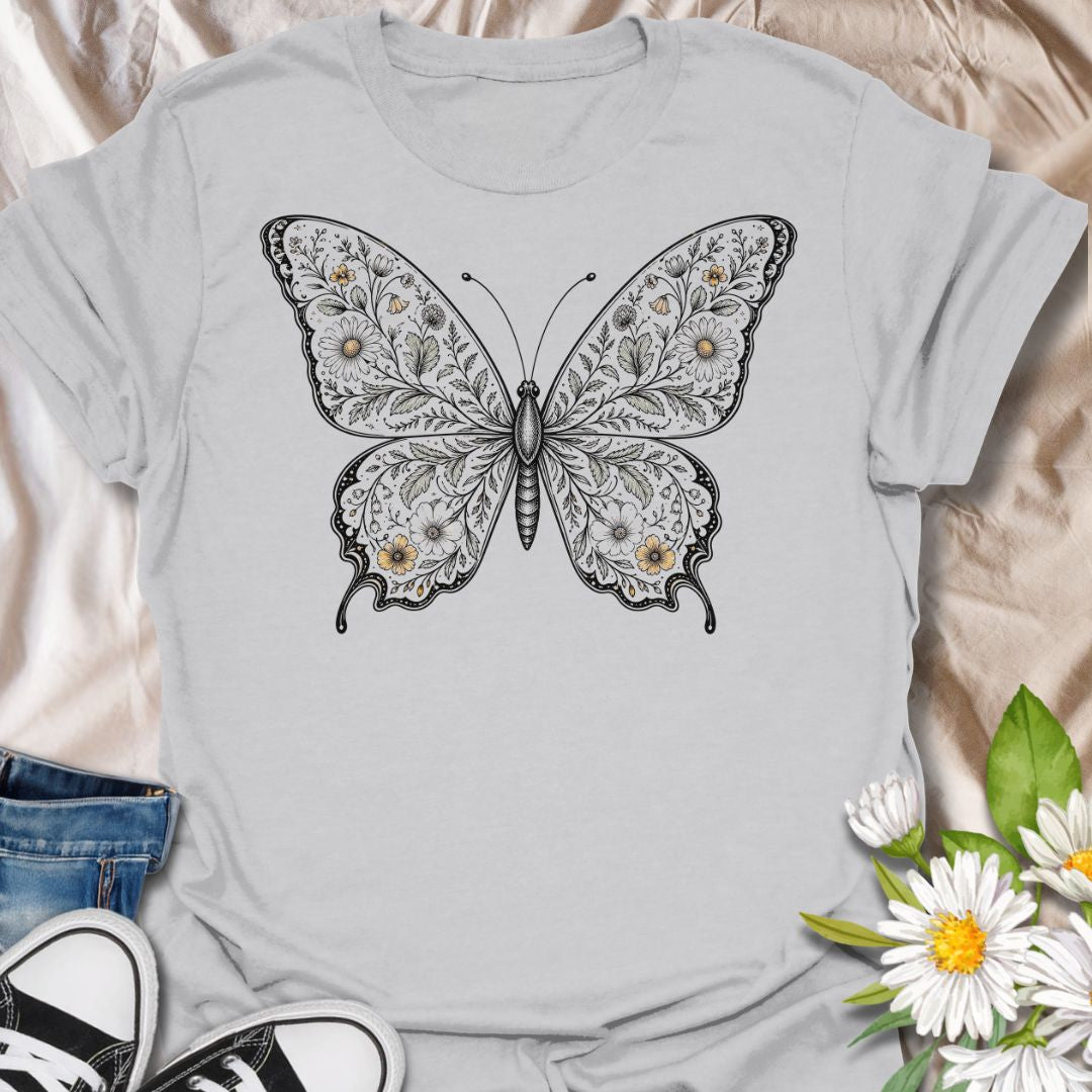 This Botanical Butterfly t-shirt is made for nature lovers who appreciate delicate details, soft floral beauty, and timeless butterfly artwork. Featuring an elegant butterfly illustration filled with intricate botanical linework and subtle floral accents, this design has a graceful vintage-inspired look that feels both artistic and wearable. Perfect for butterfly lovers, garden enthusiasts, pollinator fans, botanical art lovers, and anyone who wants a beautiful nature-themed graphic tee.