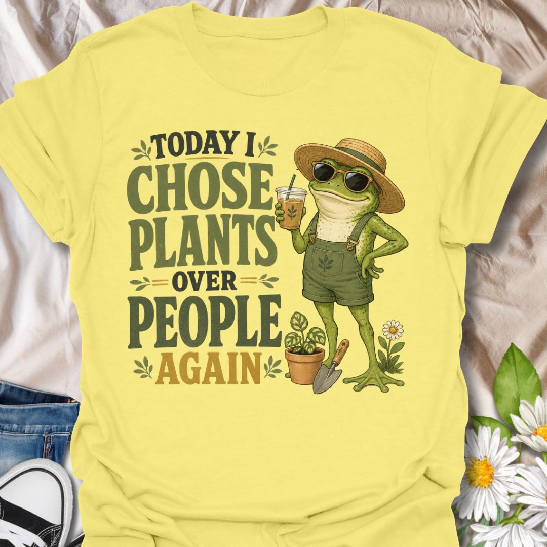 This Today I Chose Plants Over People Again t-shirt is made for plant lovers who would rather spend the day with leaves, soil, iced coffee, and zero unnecessary social plans. Featuring a smug garden frog in sunglasses, a straw hat, overalls, bold vintage lettering, and playful plant details, this design has a funny, snarky botanical vibe. Perfect for plant moms, houseplant lovers, gardeners, introverts, frog fans, and anyone who happily chooses plants over people.