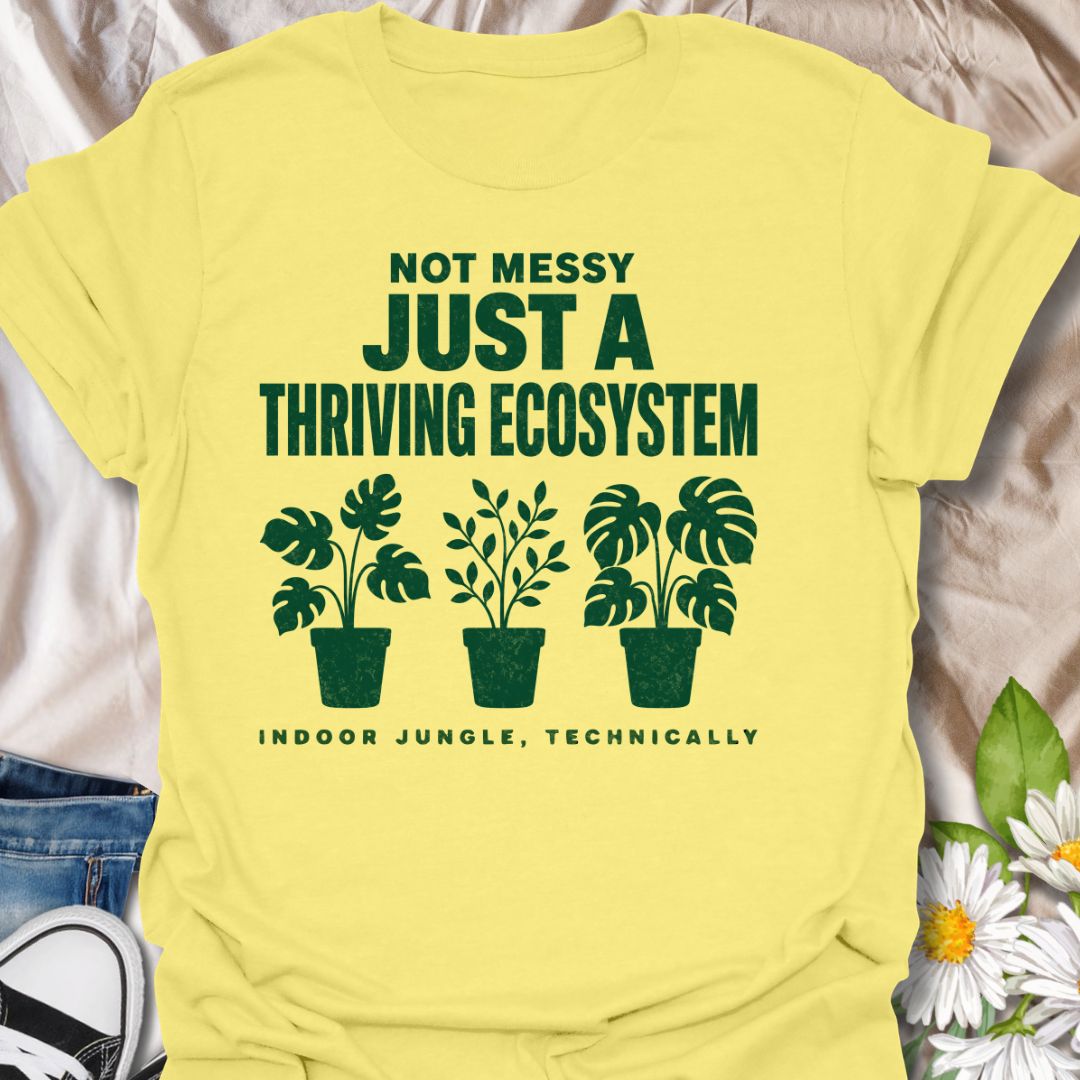 This Not Messy Just A Thriving Ecosystem t-shirt is made for houseplant lovers whose indoor jungle has officially taken over the room. Featuring bold green typography, potted plant silhouettes, monstera leaves, and the phrase indoor jungle, technically, this design is funny, relatable, and perfect for proud plant collectors. A great gift for plant moms, plant dads, houseplant lovers, indoor gardeners, and anyone who knows a few extra plants absolutely counts as an ecosystem.