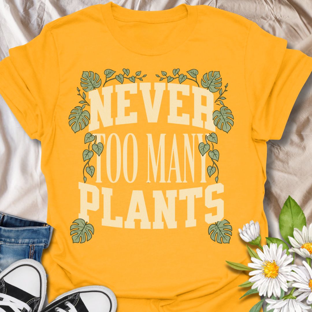 This Never Too Many Plants t-shirt is made for houseplant lovers who know there is always room for one more leafy friend. Featuring bold varsity-style lettering framed with monstera leaves and trailing vines, this design has a clean, statement botanical look for everyday plant-parent wear. Perfect for plant moms, plant dads, indoor gardeners, houseplant collectors, propagation fans, and anyone whose plant collection is never really finished.