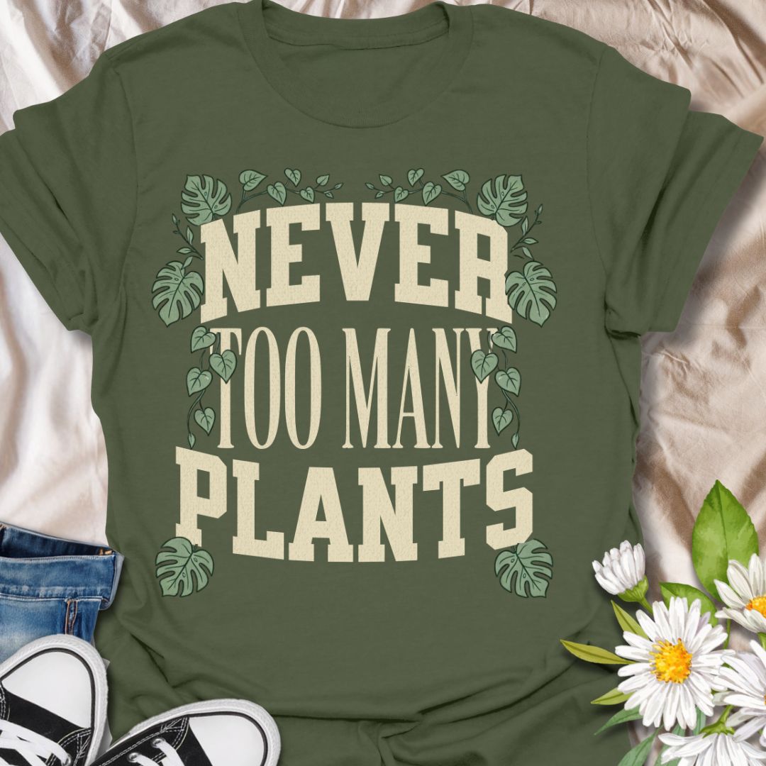 This Never Too Many Plants t-shirt is made for houseplant lovers who know there is always room for one more leafy friend. Featuring bold varsity-style lettering framed with monstera leaves and trailing vines, this design has a clean, statement botanical look for everyday plant-parent wear. Perfect for plant moms, plant dads, indoor gardeners, houseplant collectors, propagation fans, and anyone whose plant collection is never really finished.
