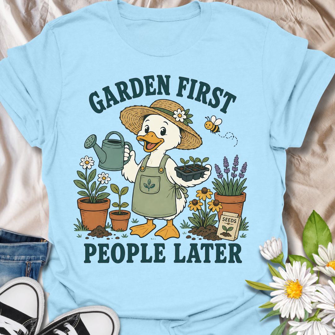 This Garden First People Later t-shirt is made for gardeners who would rather spend the day with seedlings, flowers, soil, and a watering can than deal with unnecessary social plans. Featuring a cheerful duck gardener in a straw hat holding seedlings, surrounded by potted plants, lavender, daisies, a bee, seed packet, and garden details, this design has a cute vintage botanical feel. Perfect for gardeners, plant lovers, backyard growers, flower fans, cottagecore style lovers, and anyone who happily chooses 