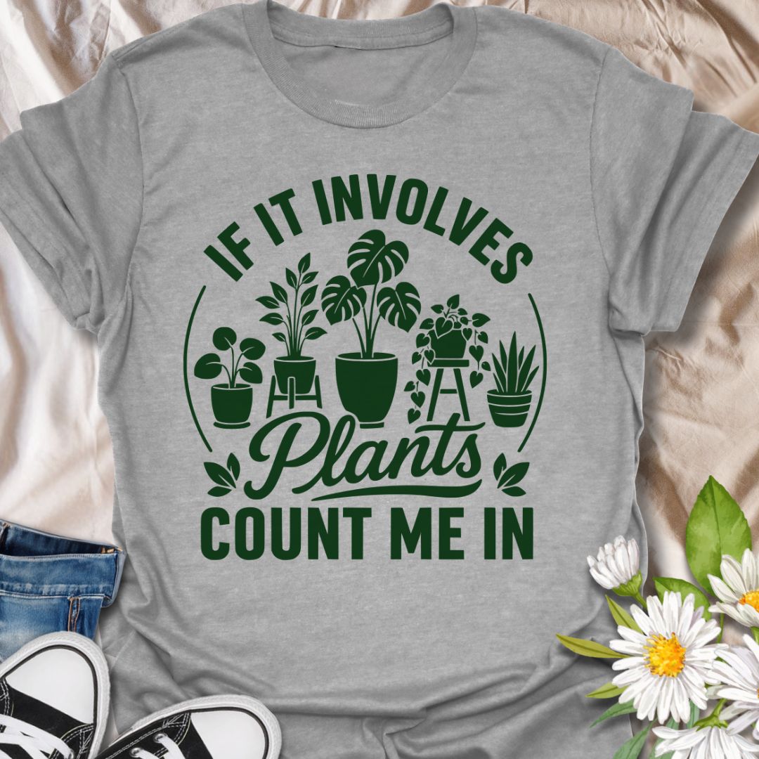 This If It Involves Plants Count Me In t-shirt is made for houseplant lovers who are always ready for anything involving leafy friends, plant shops, and indoor jungle plans. Featuring bold green typography with potted plants, monstera leaves, hanging greenery, and a clean botanical layout, this design has a simple, statement-style look for everyday plant-parent wear. Perfect for plant moms, plant dads, houseplant collectors, indoor gardeners, propagation fans, and anyone who never says no to more plants.