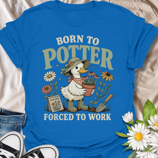This Born to Potter Forced to Work t-shirt is perfect for plant lovers, gardeners, and flower fans who would rather be potting plants than doing anything else. Featuring a charming duck gardener holding a potted flower, surrounded by blooms, gardening tools, and a wildflower seed packet, this design has a playful cottagecore feel with a whimsical gardening twist. A great choice for garden lovers, plant parents, flower enthusiasts, and anyone who lives for potting, planting, and time in the garden.