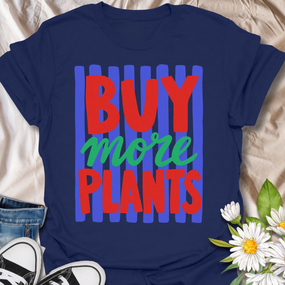 This Buy More Plants t-shirt is made for houseplant lovers who never need convincing to add another leafy friend to the collection. Featuring bold red and green typography over bright blue brushstroke stripes, this design has a fun, modern, colorful look for everyday plant-parent style. Perfect for plant moms, plant dads, indoor gardeners, houseplant collectors, plant shop fans, and anyone who believes the answer is always more plants