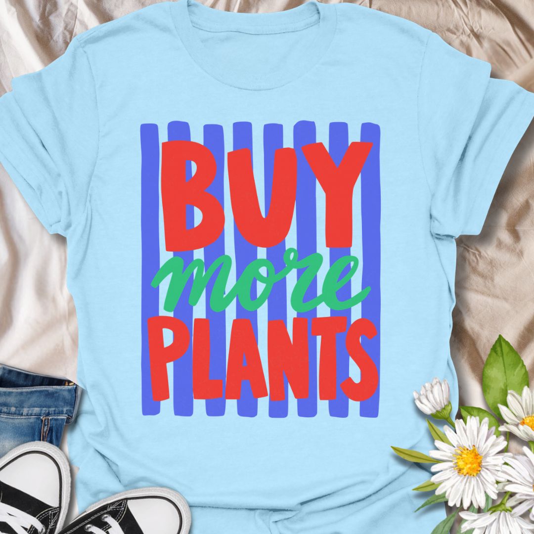 This Buy More Plants t-shirt is made for houseplant lovers who never need convincing to add another leafy friend to the collection. Featuring bold red and green typography over bright blue brushstroke stripes, this design has a fun, modern, colorful look for everyday plant-parent style. Perfect for plant moms, plant dads, indoor gardeners, houseplant collectors, plant shop fans, and anyone who believes the answer is always more plants
