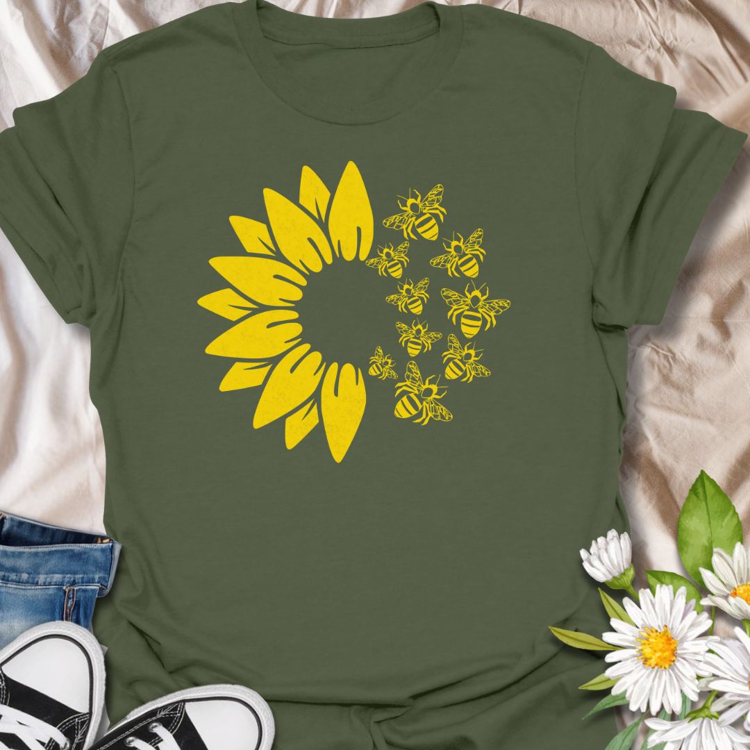 This Sunflower Bees t-shirt is made for nature lovers, gardeners, and pollinator fans who love bright sunny floral designs. Featuring a bold yellow sunflower with a swarm of buzzing bees, this simple single-colour design has a cheerful garden-inspired look that feels clean, fresh, and easy to wear. Perfect for bee lovers, sunflower fans, gardeners, wildflower lovers, pollinator supporters, and anyone who wants a happy nature-themed graphic tee.
