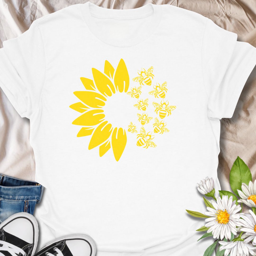 This Sunflower Bees t-shirt is made for nature lovers, gardeners, and pollinator fans who love bright sunny floral designs. Featuring a bold yellow sunflower with a swarm of buzzing bees, this simple single-colour design has a cheerful garden-inspired look that feels clean, fresh, and easy to wear. Perfect for bee lovers, sunflower fans, gardeners, wildflower lovers, pollinator supporters, and anyone who wants a happy nature-themed graphic tee.