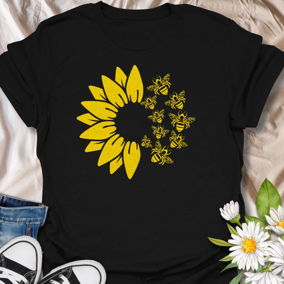 This Sunflower Bees t-shirt is made for nature lovers, gardeners, and pollinator fans who love bright sunny floral designs. Featuring a bold yellow sunflower with a swarm of buzzing bees, this simple single-colour design has a cheerful garden-inspired look that feels clean, fresh, and easy to wear. Perfect for bee lovers, sunflower fans, gardeners, wildflower lovers, pollinator supporters, and anyone who wants a happy nature-themed graphic tee.