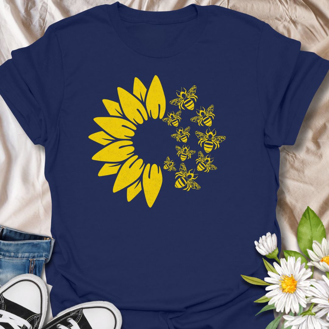This Sunflower Bees t-shirt is made for nature lovers, gardeners, and pollinator fans who love bright sunny floral designs. Featuring a bold yellow sunflower with a swarm of buzzing bees, this simple single-colour design has a cheerful garden-inspired look that feels clean, fresh, and easy to wear. Perfect for bee lovers, sunflower fans, gardeners, wildflower lovers, pollinator supporters, and anyone who wants a happy nature-themed graphic tee.