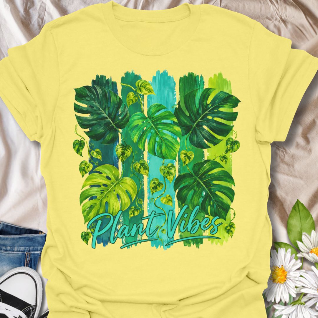This Plant Vibes t-shirt is made for houseplant lovers who like their botanical style bright, bold, and full of leafy energy. Featuring painterly green monstera leaves, trailing pothos vines, colorful brushstroke stripes, and flowing Plant Vibes lettering, this design has a fresh tropical look for everyday plant-parent wear. Perfect for plant moms, plant dads, indoor gardeners, monstera lovers, houseplant collectors, and anyone who loves a vibrant indoor jungle aesthetic.