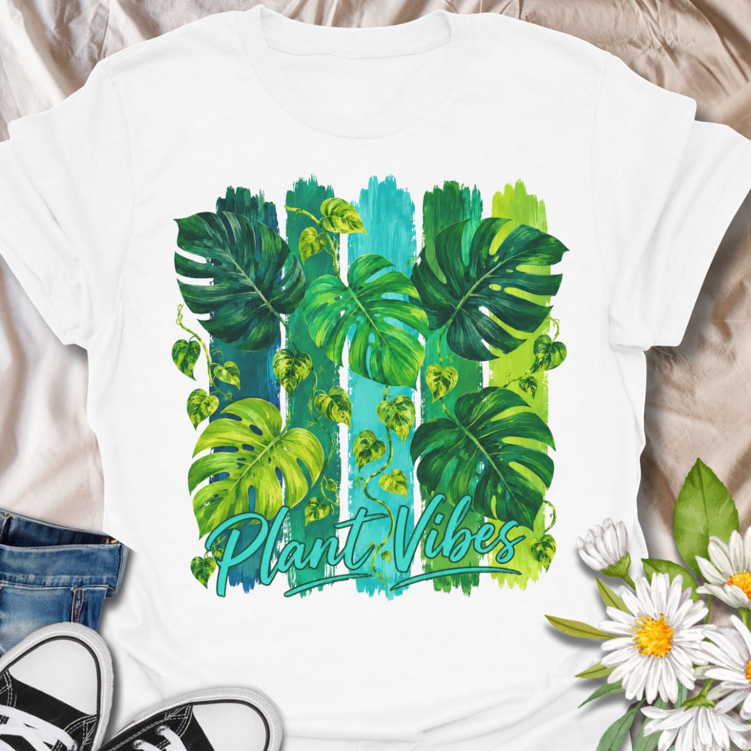 This Plant Vibes t-shirt is made for houseplant lovers who like their botanical style bright, bold, and full of leafy energy. Featuring painterly green monstera leaves, trailing pothos vines, colorful brushstroke stripes, and flowing Plant Vibes lettering, this design has a fresh tropical look for everyday plant-parent wear. Perfect for plant moms, plant dads, indoor gardeners, monstera lovers, houseplant collectors, and anyone who loves a vibrant indoor jungle aesthetic.