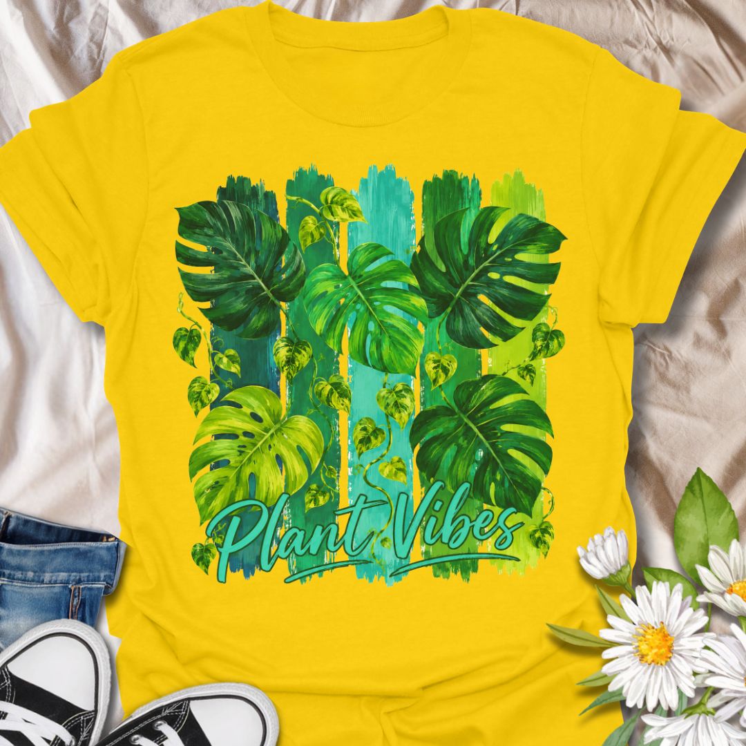 This Plant Vibes t-shirt is made for houseplant lovers who like their botanical style bright, bold, and full of leafy energy. Featuring painterly green monstera leaves, trailing pothos vines, colorful brushstroke stripes, and flowing Plant Vibes lettering, this design has a fresh tropical look for everyday plant-parent wear. Perfect for plant moms, plant dads, indoor gardeners, monstera lovers, houseplant collectors, and anyone who loves a vibrant indoor jungle aesthetic.