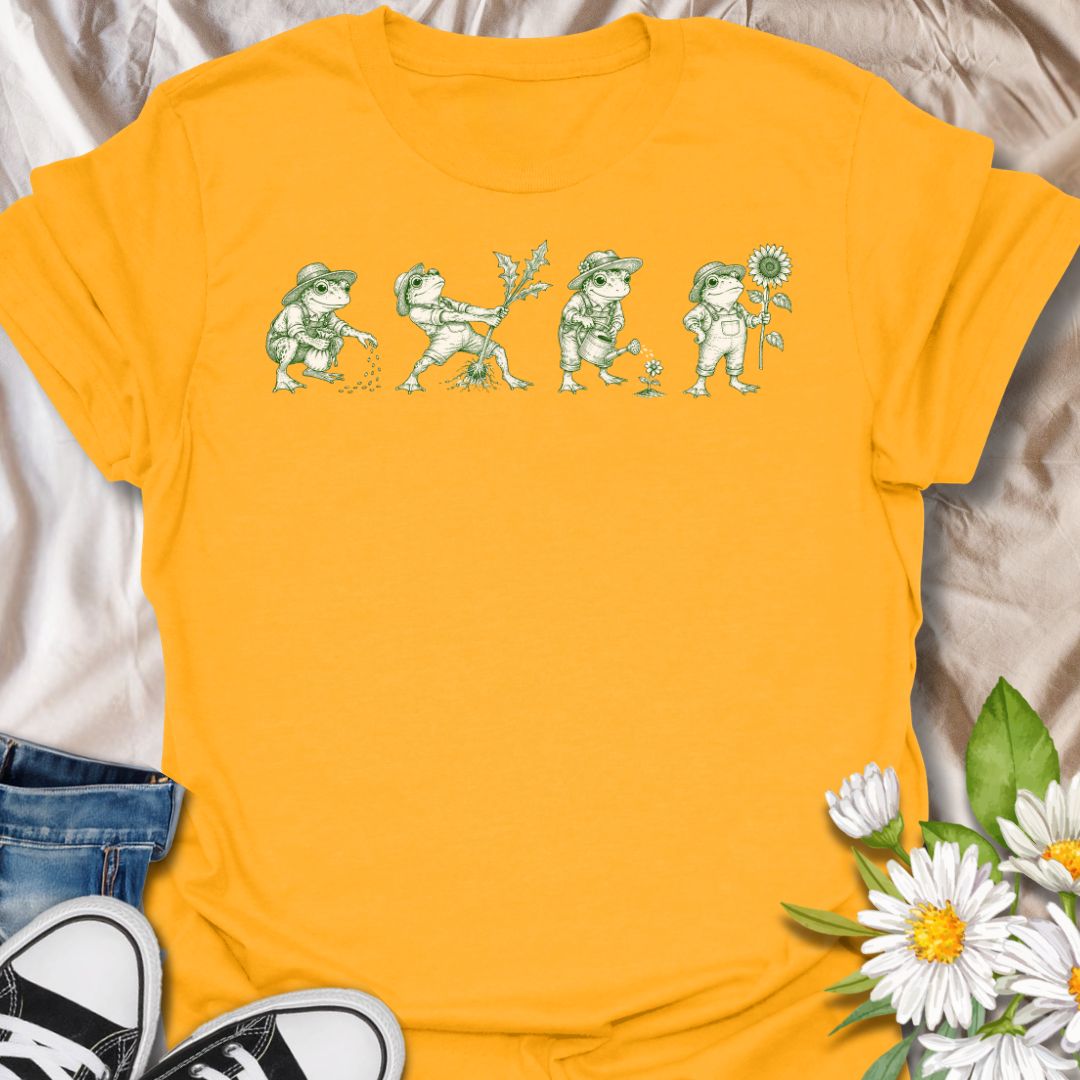 This Gardening Frogs t-shirt is made for plant lovers, gardeners, and frog fans who enjoy a whimsical nature-inspired design. Featuring four charming frogs doing garden tasks in a vintage green ink illustration style, this design has a playful cottagecore feel with plenty of botanical personality. Perfect for gardeners, plant moms, frog lovers, nature fans, cottagecore style lovers, and anyone who thinks gardening is better with a little amphibian charm.
