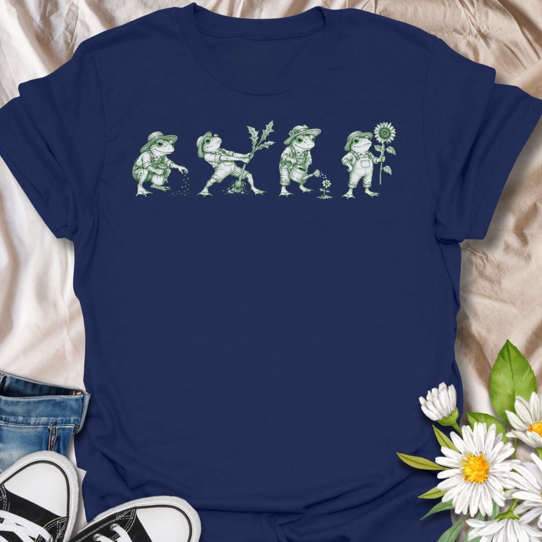 This Gardening Frogs t-shirt is made for plant lovers, gardeners, and frog fans who enjoy a whimsical nature-inspired design. Featuring four charming frogs doing garden tasks in a vintage green ink illustration style, this design has a playful cottagecore feel with plenty of botanical personality. Perfect for gardeners, plant moms, frog lovers, nature fans, cottagecore style lovers, and anyone who thinks gardening is better with a little amphibian charm.