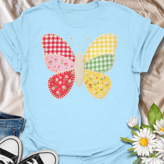 This faux Patchwork Butterfly t-shirt is made for nature lovers who enjoy bright, cheerful designs with a look of being handmade all achieved through printing methods. Featuring a colorful butterfly made from gingham and floral patchwork-style panels with faux stitched details, this design has a sweet cottagecore look that feels playful, crafty, and full of charm. Perfect for butterfly lovers, flower fans, gardeners, cottagecore style lovers, sewing fans, and anyone who loves soft, whimsical nature-in