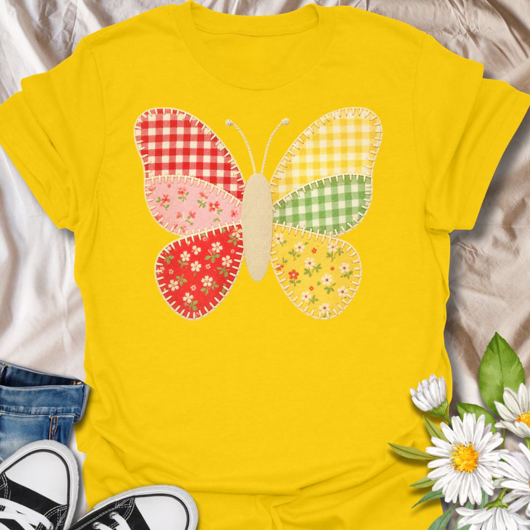 This faux Patchwork Butterfly t-shirt is made for nature lovers who enjoy bright, cheerful designs with a look of being handmade all achieved through printing methods. Featuring a colorful butterfly made from gingham and floral patchwork-style panels with faux stitched details, this design has a sweet cottagecore look that feels playful, crafty, and full of charm. Perfect for butterfly lovers, flower fans, gardeners, cottagecore style lovers, sewing fans, and anyone who loves soft, whimsical nature-in