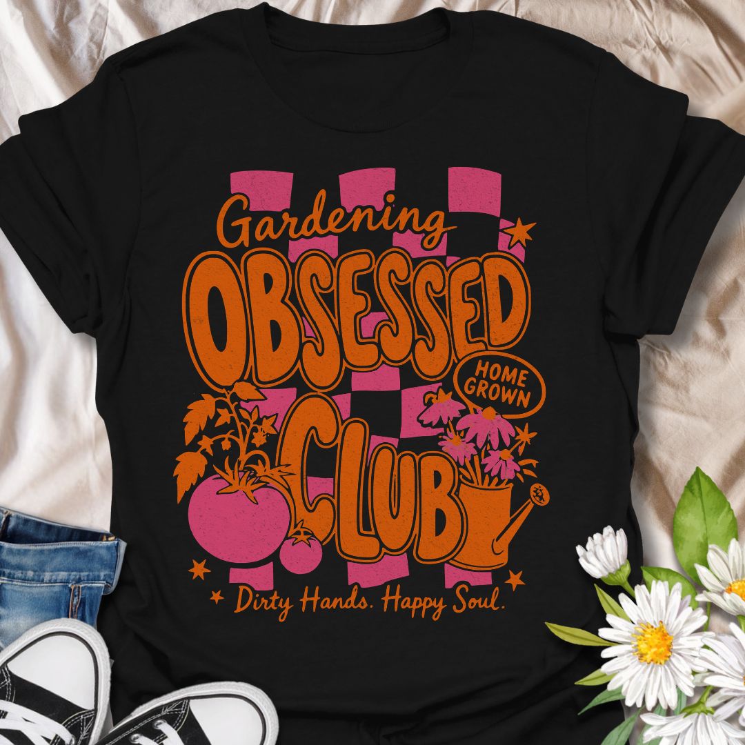 This Gardening Obsessed Club t-shirt is made for gardeners who know dirty hands, homegrown plants, and a happy soul go together perfectly. Featuring bold retro orange lettering, pink checkerboard accents, tomatoes, flowers, a watering can, and playful garden details, this design has a bright vintage-inspired feel full of personality. Perfect for gardeners, plant lovers, vegetable growers, flower fans, cottagecore style lovers, and anyone proudly part of the gardening obsessed club.
