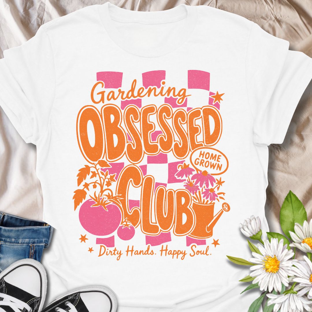 This Gardening Obsessed Club t-shirt is made for gardeners who know dirty hands, homegrown plants, and a happy soul go together perfectly. Featuring bold retro orange lettering, pink checkerboard accents, tomatoes, flowers, a watering can, and playful garden details, this design has a bright vintage-inspired feel full of personality. Perfect for gardeners, plant lovers, vegetable growers, flower fans, cottagecore style lovers, and anyone proudly part of the gardening obsessed club.