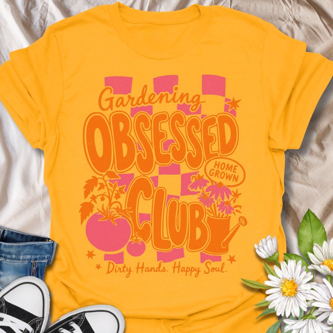 This Gardening Obsessed Club t-shirt is made for gardeners who know dirty hands, homegrown plants, and a happy soul go together perfectly. Featuring bold retro orange lettering, pink checkerboard accents, tomatoes, flowers, a watering can, and playful garden details, this design has a bright vintage-inspired feel full of personality. Perfect for gardeners, plant lovers, vegetable growers, flower fans, cottagecore style lovers, and anyone proudly part of the gardening obsessed club.