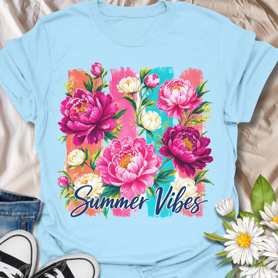 This Summer Vibes t-shirt is made for flower lovers who want a bright, cheerful design full of colour and warm-weather energy. Featuring bold pink peonies, soft cream blossoms, leafy greenery, painterly brushstroke panels, and flowing Summer Vibes lettering, this design has a fresh floral look that feels joyful and eye-catching. Perfect for garden lovers, flower fans, botanical style lovers, cottagecore outfits, summer wardrobes, and anyone who loves vibrant floral artwork.