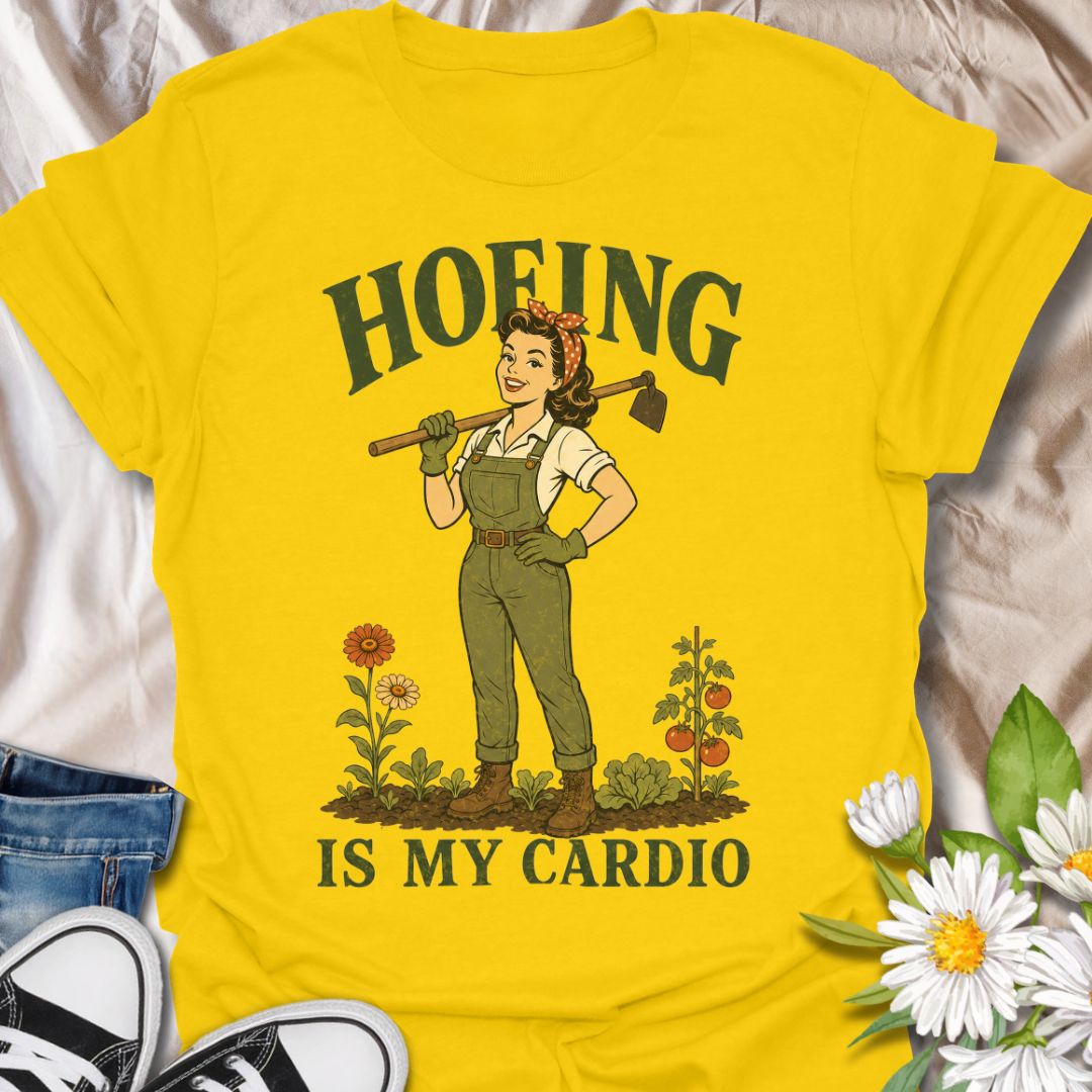 This Hoeing Is My Cardio t-shirt is made for gardeners who know working the soil, pulling weeds, and tending the vegetable patch absolutely counts as exercise. Featuring a vintage-style gardener holding a hoe, with flowers, tomatoes, greenery, and bold retro lettering, this design has a funny garden-humor feel with classic pin-up charm. Perfect for gardeners, plant lovers, backyard growers, vegetable gardeners, flower fans, homesteaders, and anyone who gets their workout in the garden.